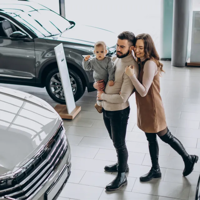 family-with-toddler-girl-choosing-car-car-showroom 2 (6)